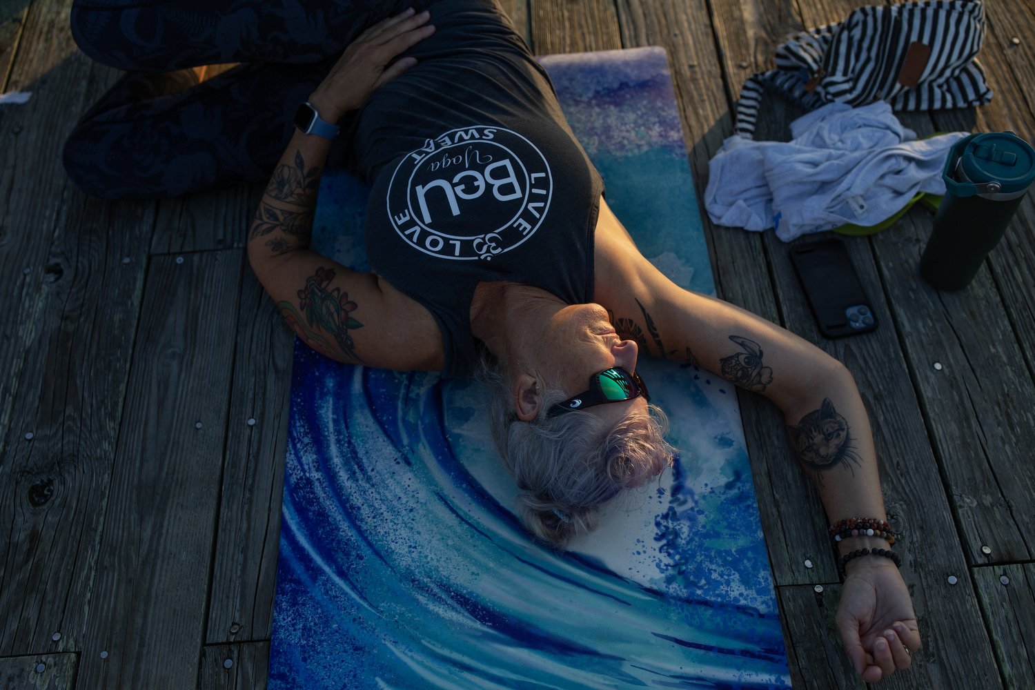  Amanda Brown participates in a sunrise yoga class on the Crystal Pier at Wrightsville Beach, North Carolina.  For The Washington Post 