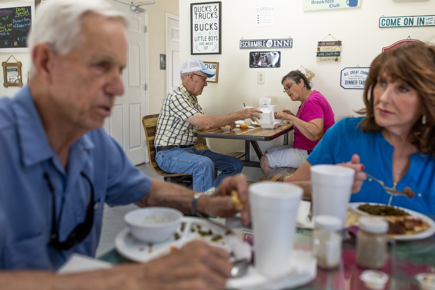  (Left to right) Sam Davis, Ted Lewis, Emily Lewis, and Judy Cullipher eat lunch at Grilling Buddies in Pollocksville, North Carolina.  For The Assembly 