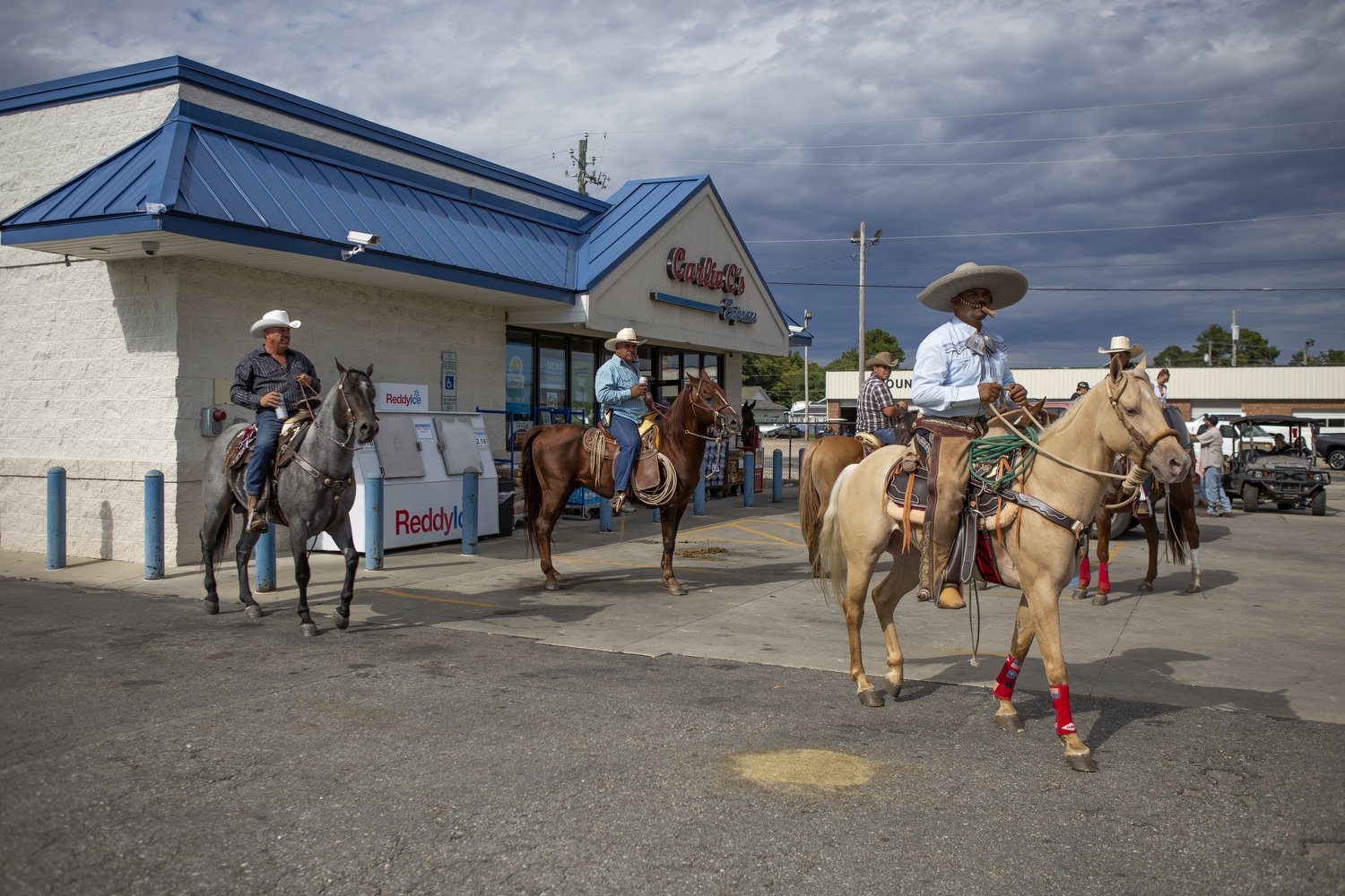  Riders in cowboy hats and sombreros take over Benson, North Carolina during Mule Days. Mule Days, which has been held for 73 years, features a festival, music, a parade, and rodeos. Riders maneuver their horses and mules throughout the town in an ev