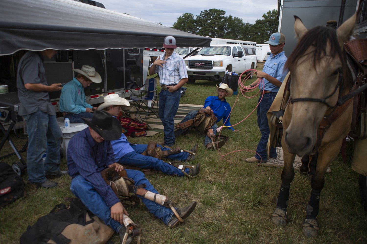  Bronc riders practice before the Mule Days rodeo in Benson, North Carolina on September 24, 2022. Mule Days, which has been held for 73 years, features a festival, music, a parade, and rodeos. Riders maneuver their horses and mules throughout the to