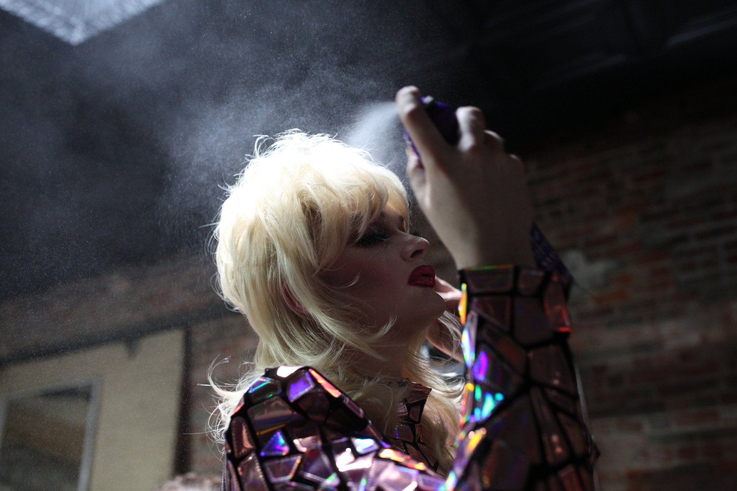  Veruca Salt, a drag performer based in Raleigh, sprays her hair before performing at The Herritage in Kinston, North Carolina. Salt explains that she snuck into her first drag event at age 17. "I saw the local queens do an amazing show and knew inst