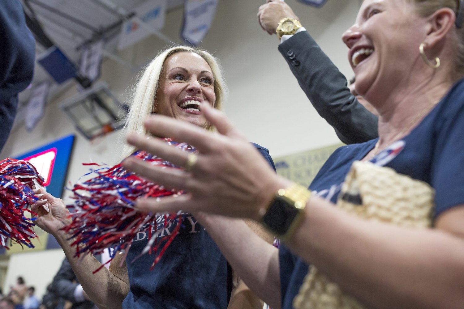  Tara Wood, left, Chair of the Charleston chapter of Moms for Liberty, and Vice Chair April Coleman, right, cheer during an event for presidential candidate Tim Scott at Charleston Southern University in Charleston, South Carolina. The Moms for Liber