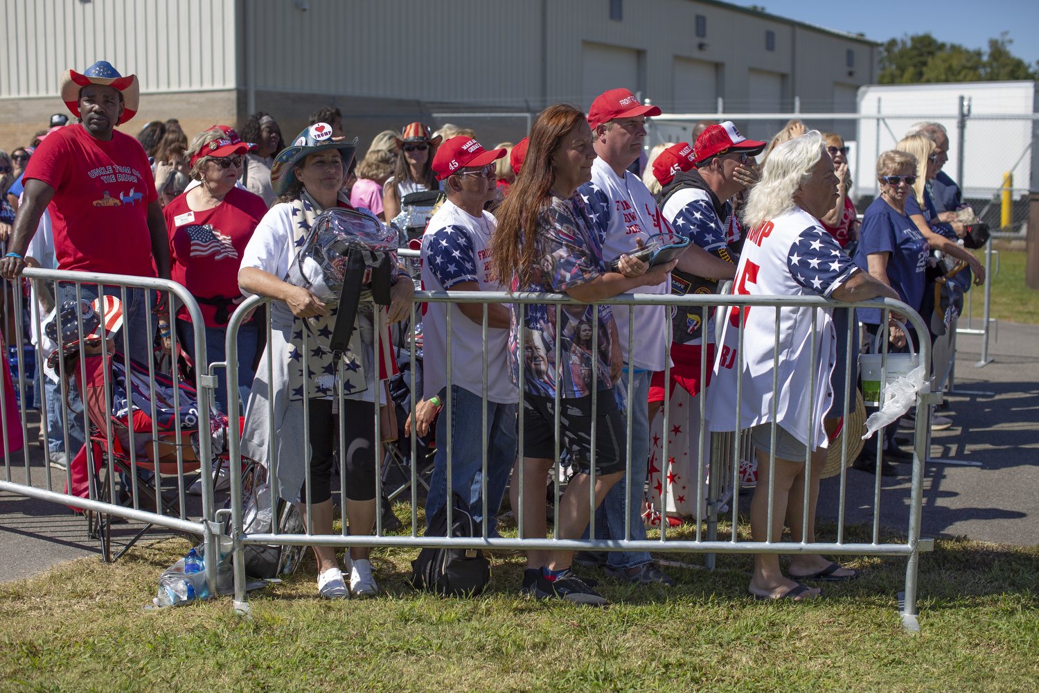  Supporters of former President Donald Trump wait in line before a rally in Wilmington, North Carolina.  For The Washington Post 