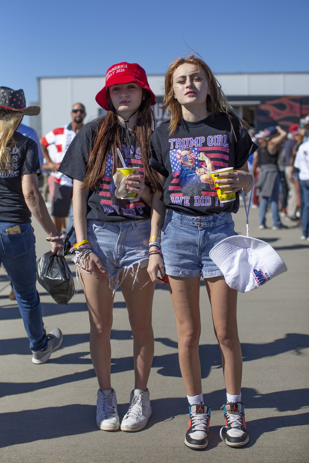  Jess Huntley, left, and Izzy Oberci, right, attend a rally for former President Donald Trump in Wilmington, North Carolina.  For The Washington Post 