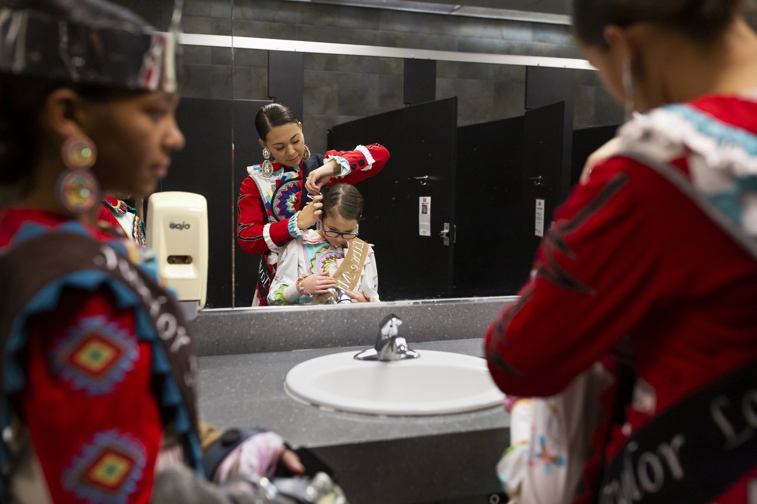  Miss Lumbee Taylor Locklear, center, adjusts Riley Dial’s hair while Kynnady Locklear, left, looks on during the American Indian Heritage Celebration in Raleigh. Despite being one of the largest tribes in the eastern United States, the Lumbee Tribe 