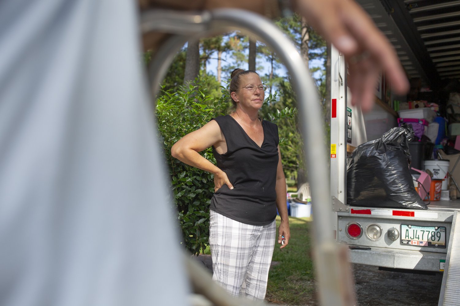 Terri Straka talks with her family as they help her move into her new home in Myrtle Beach, South Carolina. Straka is part of a buyout program to relocate Horry County residents away from flood prone areas and into safer homes.  For The Washington P