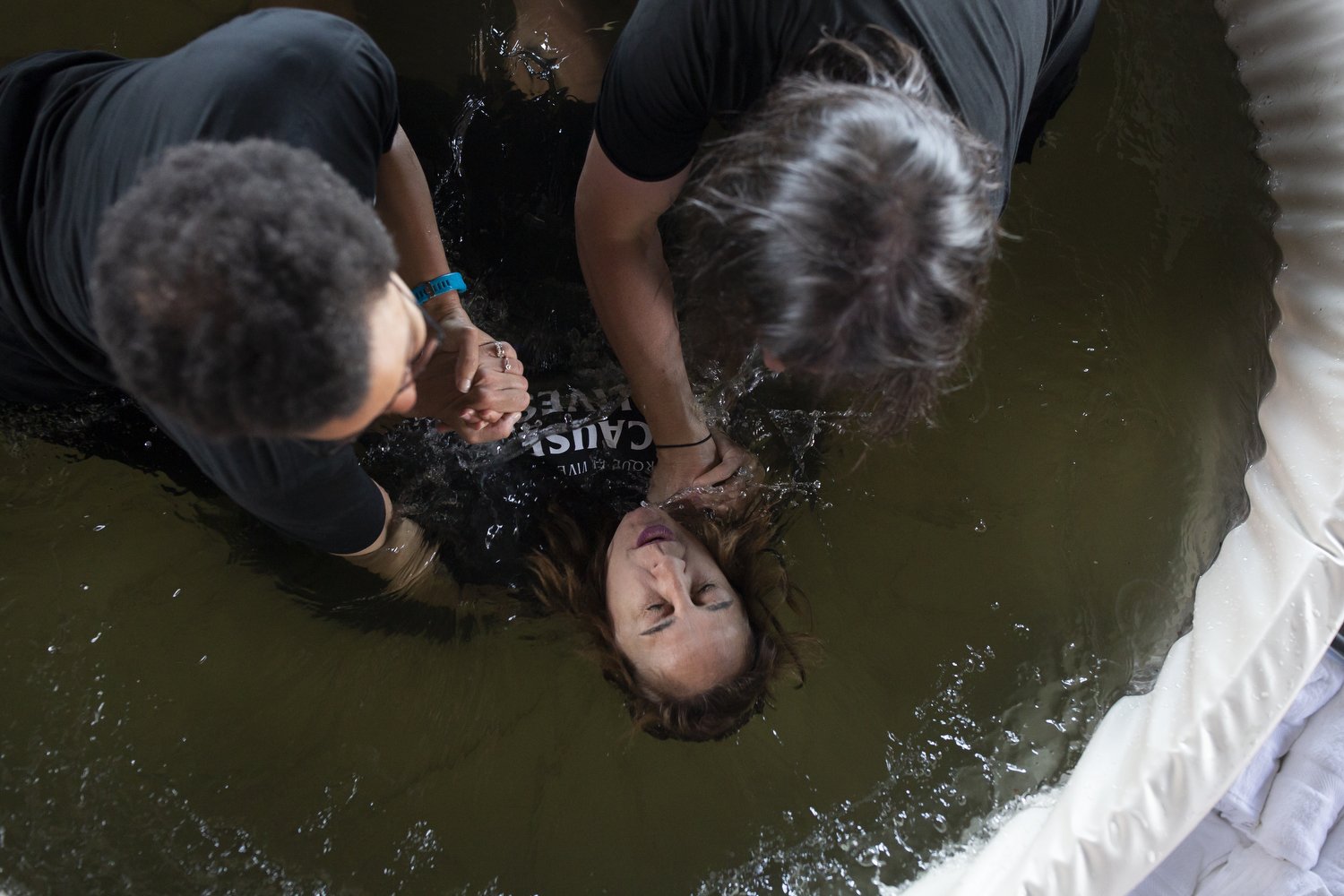  Melissa Chin is baptized during the Summit Church Easter Sunday service at Walnut Creek Amphitheater in Raleigh.  For The Assembly 