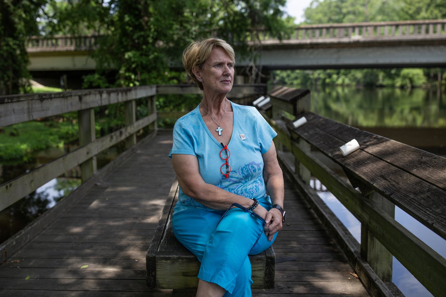  Commissioner Nancy Barbee sits along the banks of the Trent River in Pollocksville, North Carolina where generations of her family have grown up.   For The Assembly 