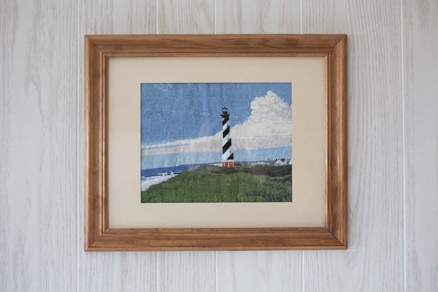  A cross stitch of the Cape Hatteras Lighthouse hangs in Maria and Paul Linden’s beach house in Avon, North Carolina. The house represents a dream that the Lindens say they have had for a long time. They bought the ocean front property in October 202