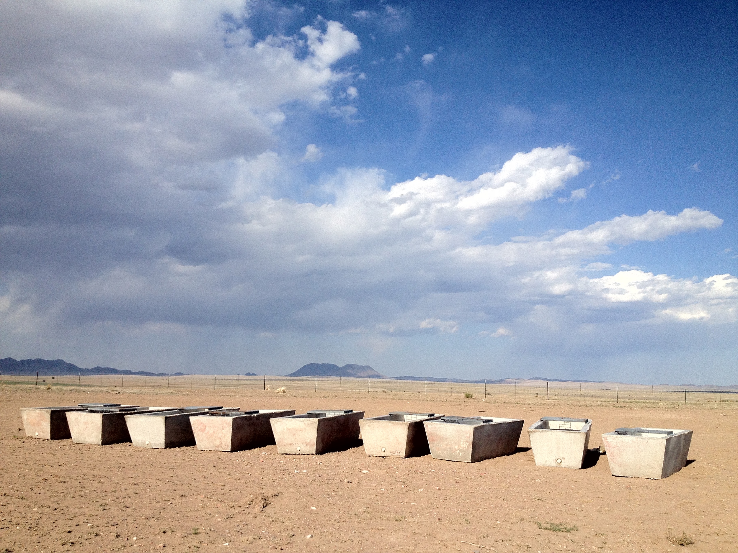 West Texas sky. These cisterns almost seem like an installation, but they are actually part of a ranch. 