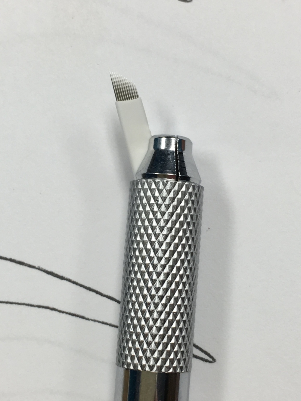 The microblade tool from Everlasting Brows using an 11 point needle tip