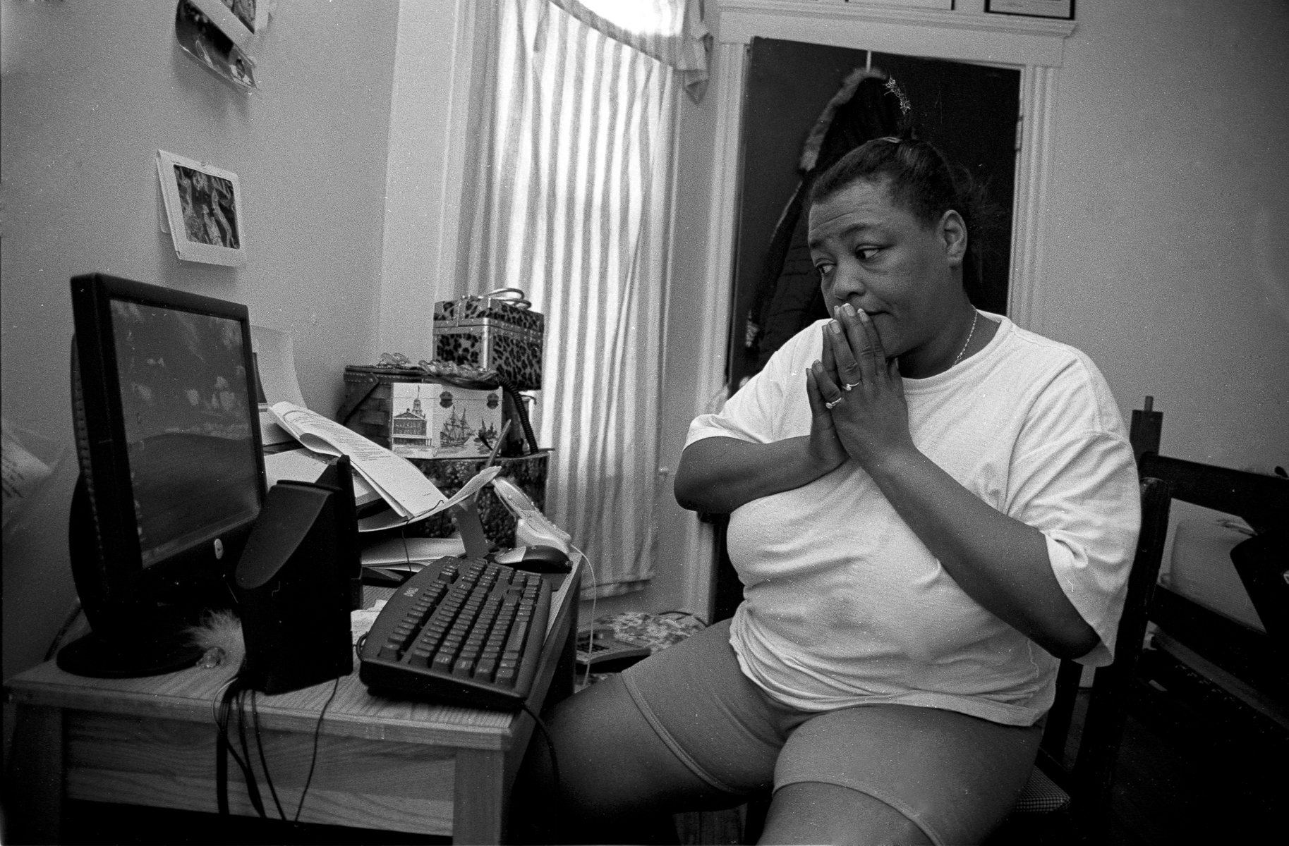 Toddye working on her essay for 1 family Scholar application at her apartment.