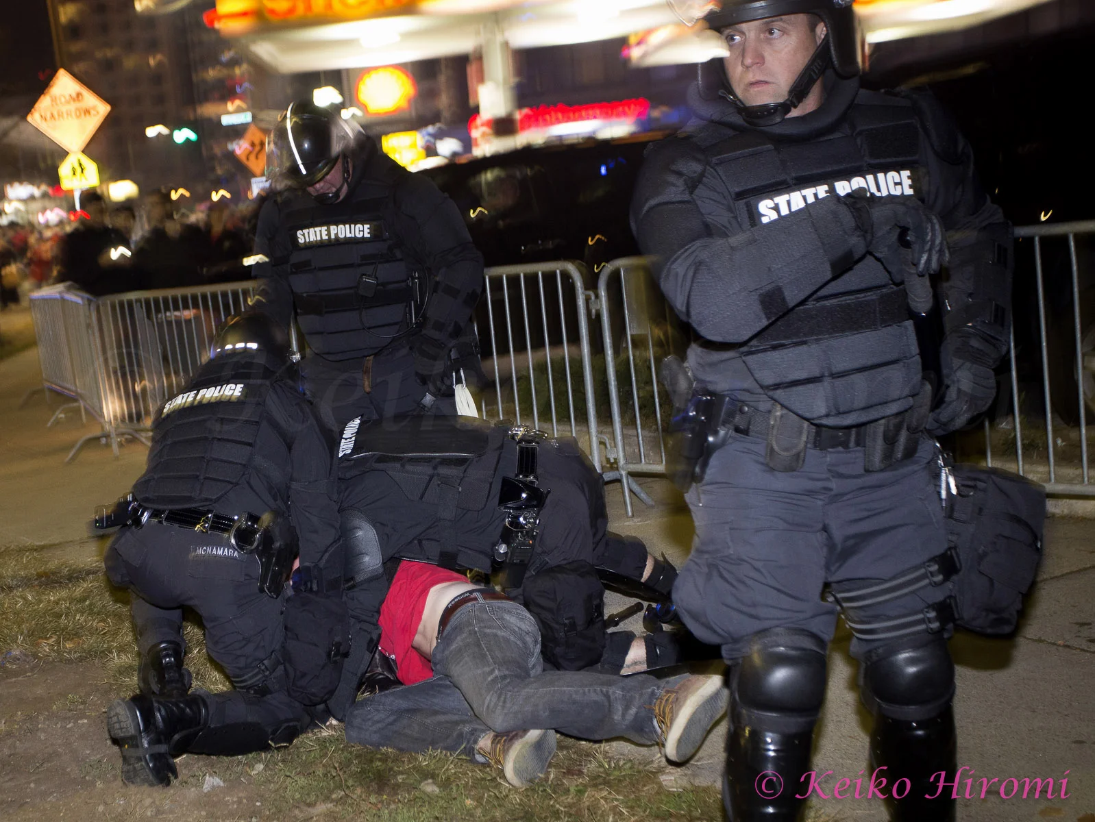 October 30 2013, Boston, MA USA; Mass State Police in riot gear arrested a fan during the celebration of the Boston Red Sox defeating the St. Louis Cardinals to win the World Series just outside Fenway Park in Boston, MA.