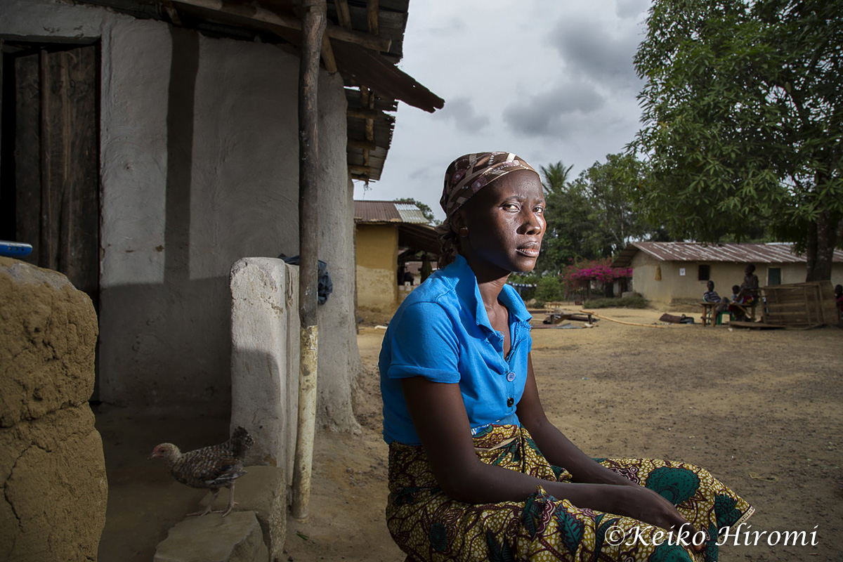 February 21, 2015, Freeman Reserved, Todee District Montserrado County, Liberia: Ebola Survivor Mary Kollie at her rented house in Freeman Reserved, Liberia. "I am a permanent citizen of Freeman Reserved, with 4 children. I am living in a rented house. The house owner got sick and died on September 18, 2014 in the house where we lived. The entire members of the house were quarantined at the school building for 21 days. While we were in the school, my daughter Beatrice Beayee, 12 years got sick and was transferred to ELWA ETU and died one week later. My other two children and I got sick and taken to the same ETU. We were admitted for one month and discharged on October 2014. Since my two children and I came back home, my husband abandoned us and I do not know his whereabouts. He was afraid of us and has never come back to see us"