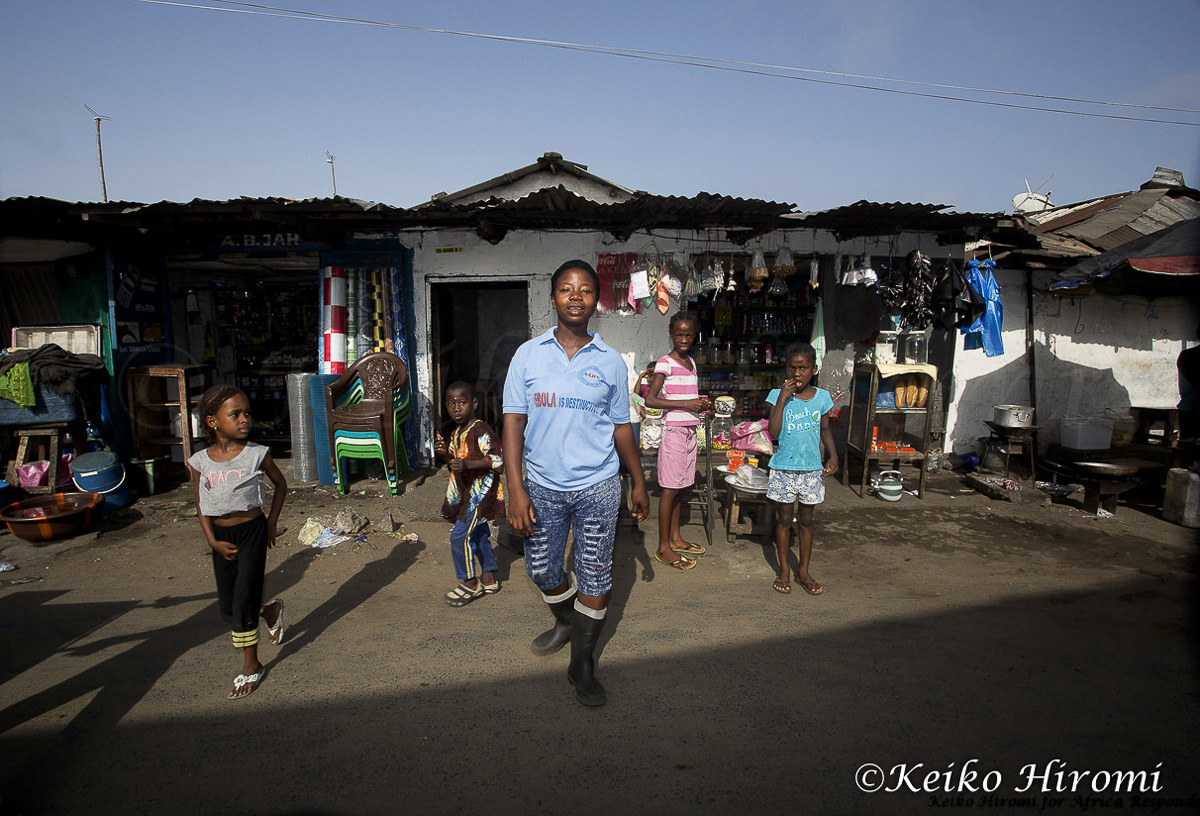 February 19, 2015: West Point, Monrovia, Liberia: A teen activist of A-Life"(Adolescents Leading the Intense Fight against Ebola) on streets of West Point, Monrovia, Liberia. They received training through UNICEF and a local charity "Think" on preventing the spread of Ebola virus. West Point was one of the worst slums in West Africa. Schools in Liberia has started re-opening schools on February 16, after closing schools last July. Due to impact of Ebola crisis on Liberian economy, many youth may not be able to go back to schools. 