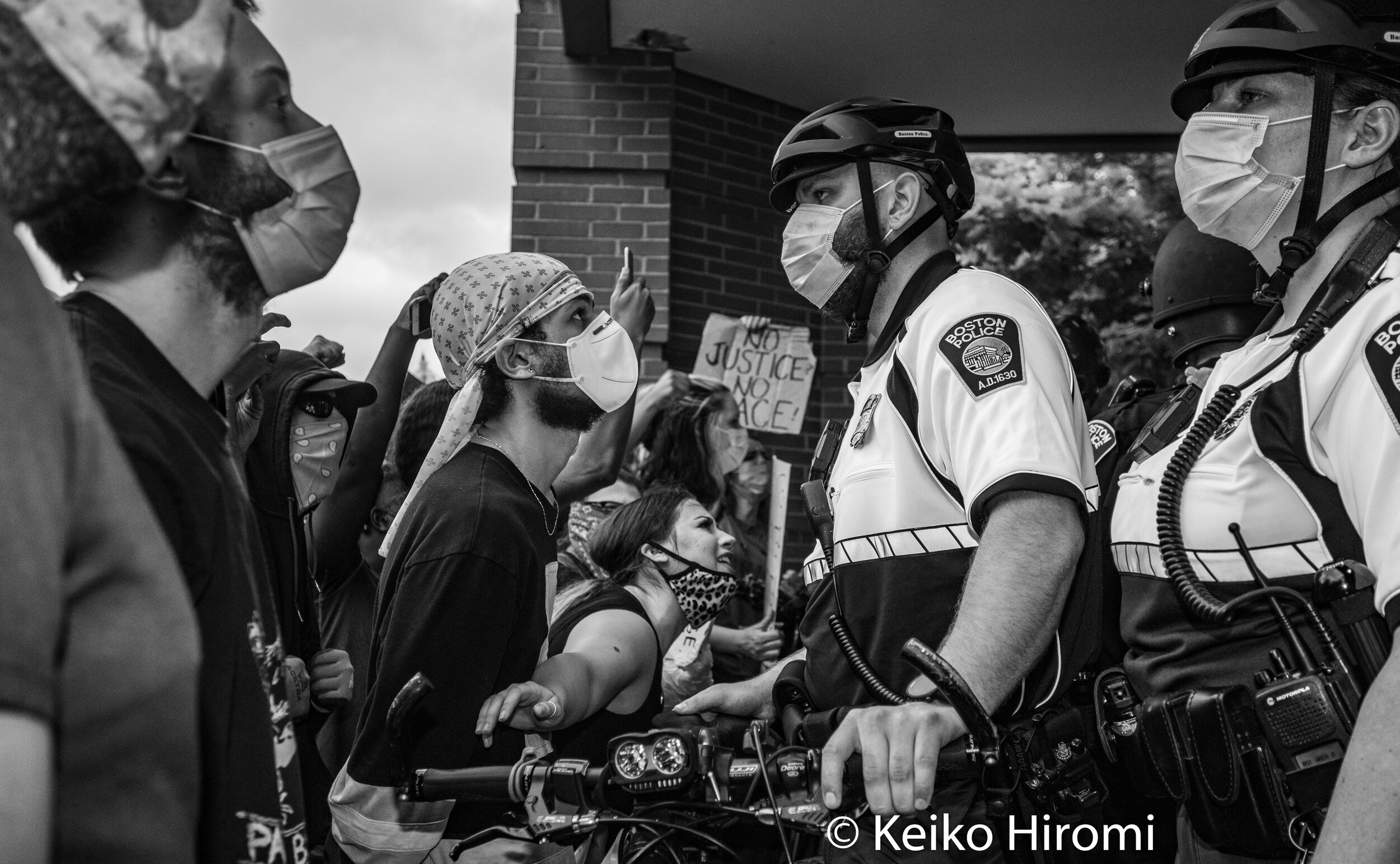  May 29, 2020, Boston, Massachusetts, USA: Demonstrators protest police and racism in front of Boston Police D-4 staion during a rally in response to deaths of George Floyd and against police brutality and racism at Peter's park in Boston, Massachuse