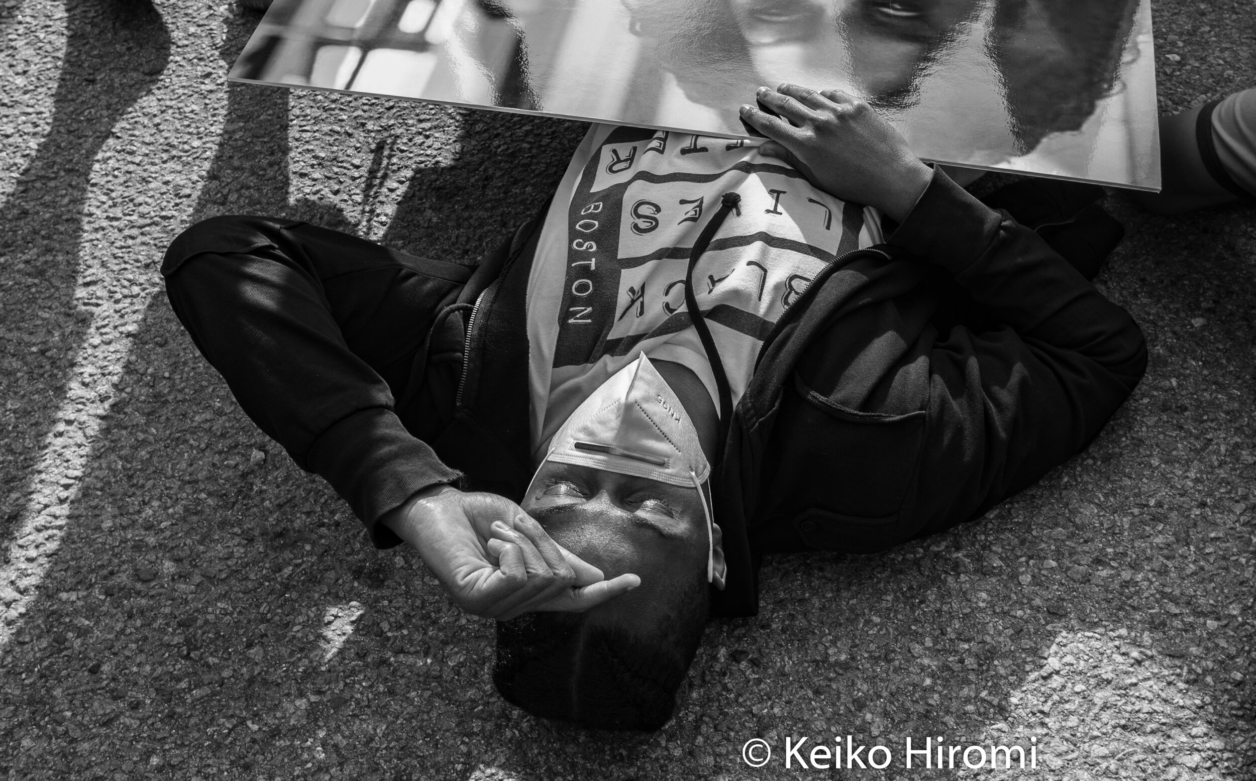  June 2, 2020, Boston, Massachusetts, USA: A protester stages "die in" protest during a rally in response to deaths of George Floyd and against police brutality and racism at Franklin Park in Boston. 