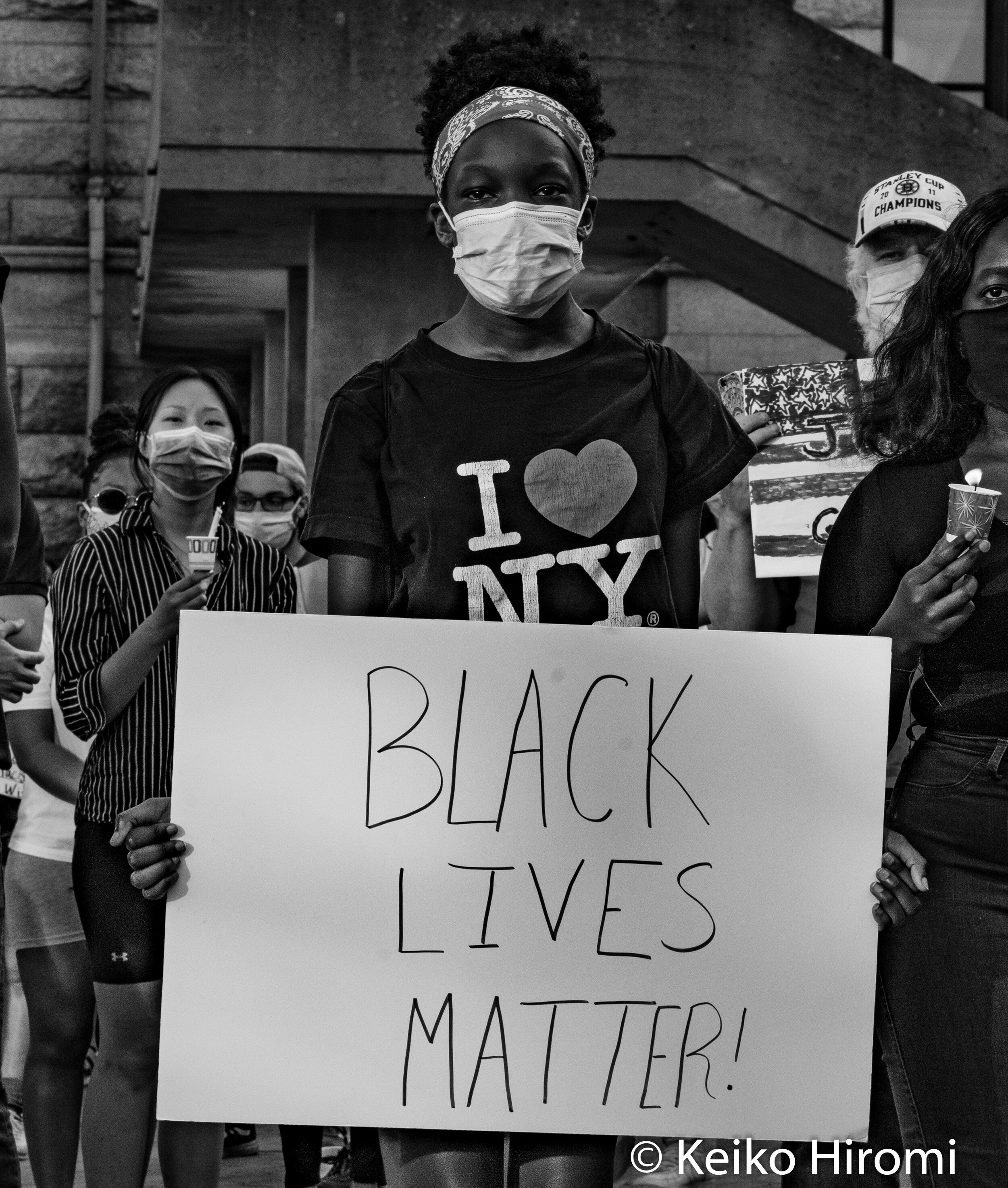  May 30, 2020, Lowell, Massachusetts, USA: A protester holds a sign "Black Lives Matter" during a rally in response to deaths of George Floyd and against police brutality and racism at JFK plaza in Lowell. 