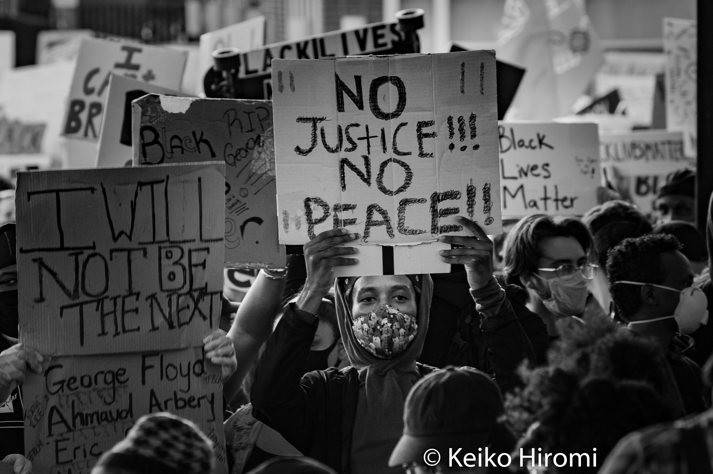  May 31, 2020, Boston, Massachusetts, USA: A protester holds a sign "No justice, no peace" during a rally in response to deaths of George Floyd and against police brutality and racism in Boston. 