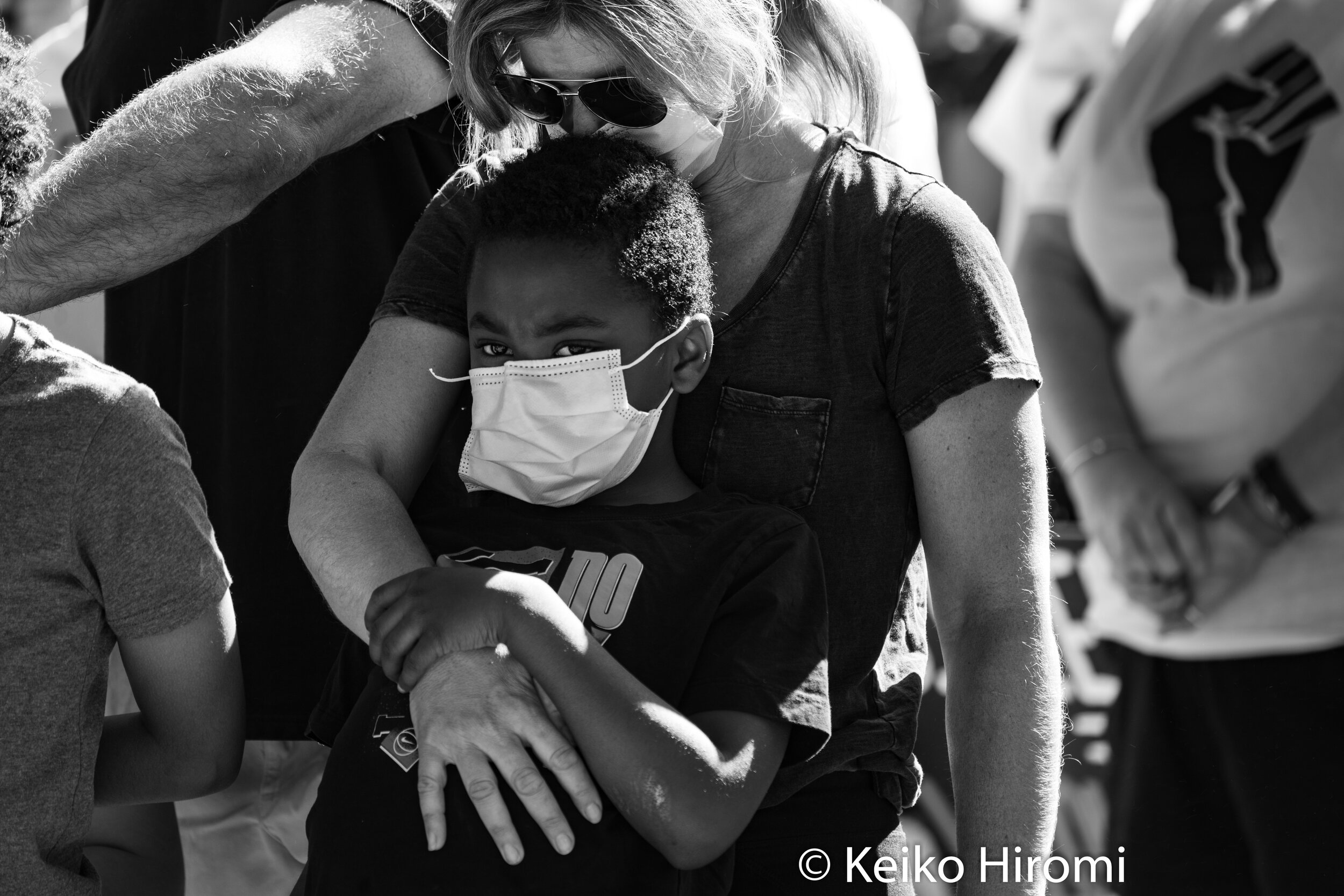  June 8, 2020, Lynnfield, Massachusetts, USA: A young protester listening to an activist during a rally in response to deaths of George Floyd and against police brutality and racism in Lynnfield. 