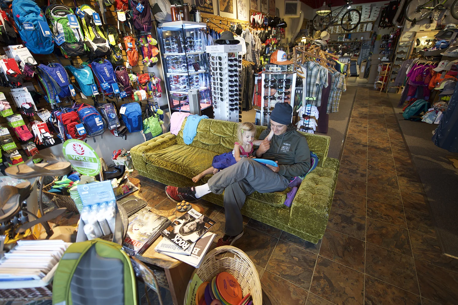 Free Heel & Wheel. Justin Spence and his daughter get in a little time on a rare guide's day off for Justin. Justin is a fly fishing guide in West and owns West Yellowstone Fly Shop. The Free Heel & Wheel sells arguably the best espresso in town and has created a relaxed community vibe where people are welcome to sit and hang out.