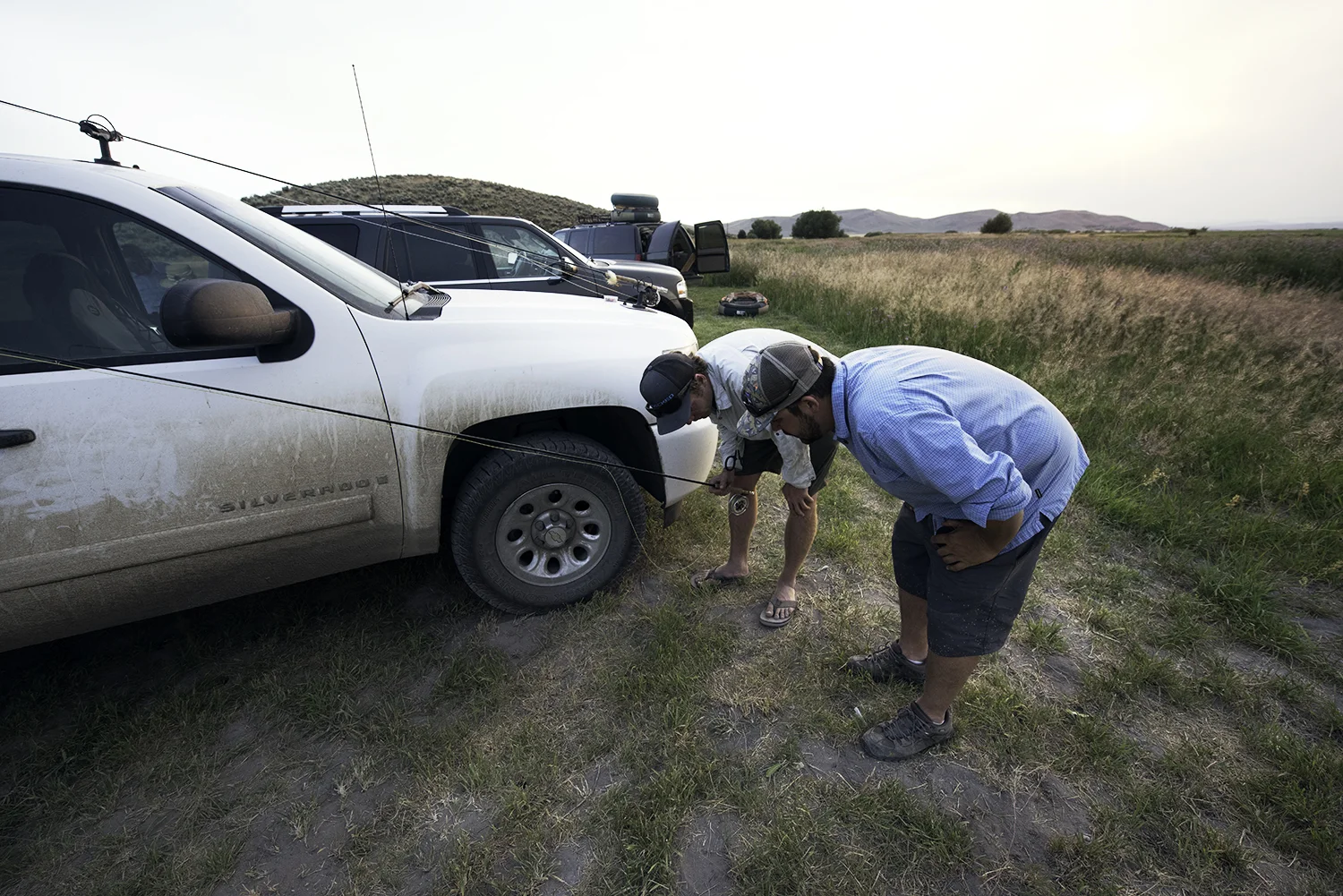 Guides Zac Mayhew and Cody Catherall look for a soon-to-be lost fly, aka a needle in the haystack. This is a moment we all go through as fly fishing guides but up until this point I had never captured the moment. I was busted too, after I was caught taking the shot. Silver Creek, Idaho.