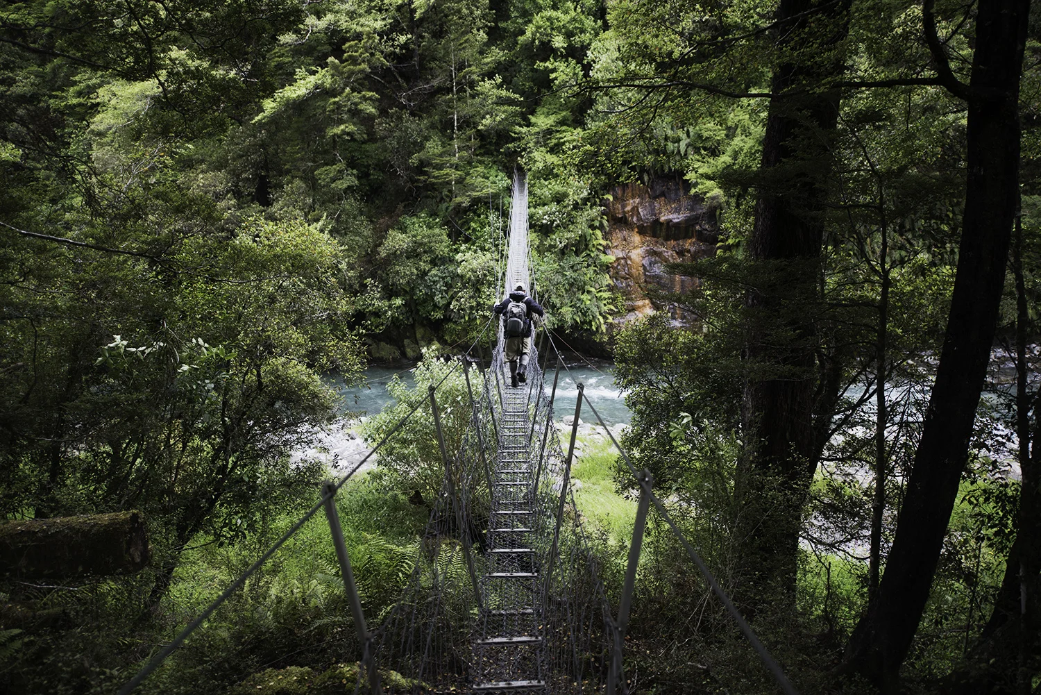 A classic backcountry swing bridge on a windy and at times rainy and at times sunny and at times cloudy day...