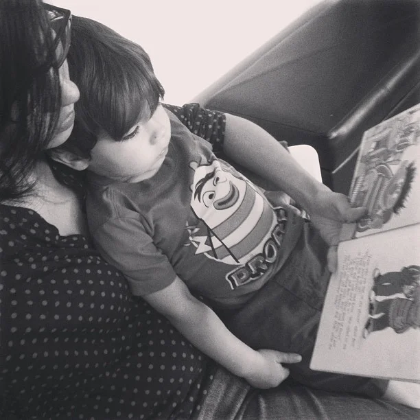 Reading with mama. 