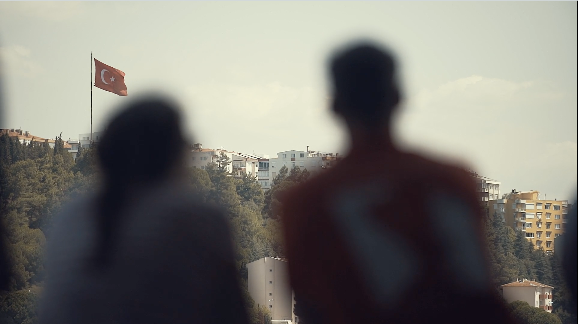 People look at a Turkish flag