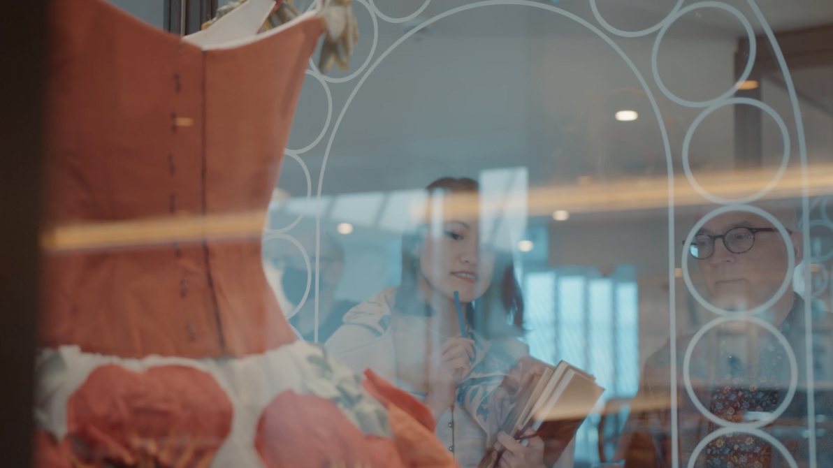 A woman looks at a dress