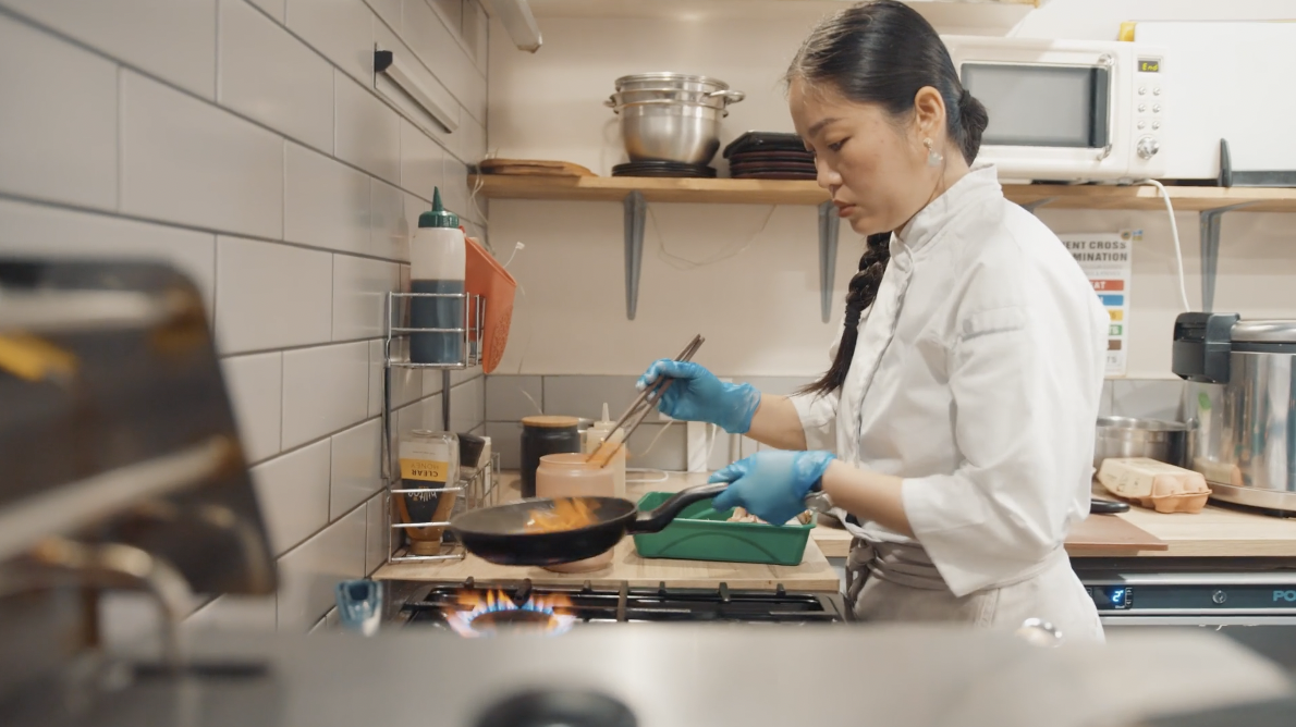 A chef cooks in her kitchen