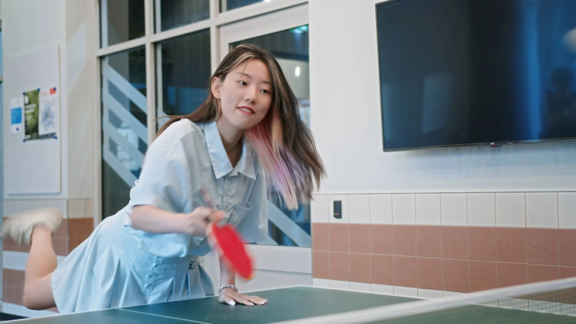 A girl plays table tennis