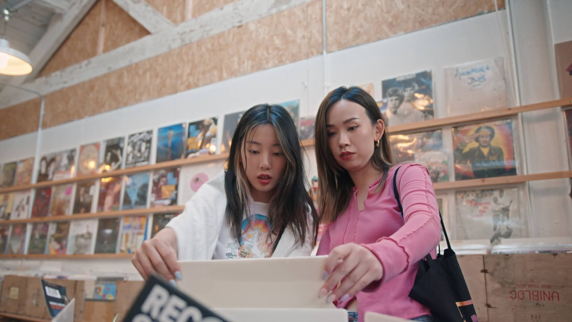 Two-Chinese-girls-look-through-records-for-Canvas-by-writer-director-editor-Jess-Dowse.jpg