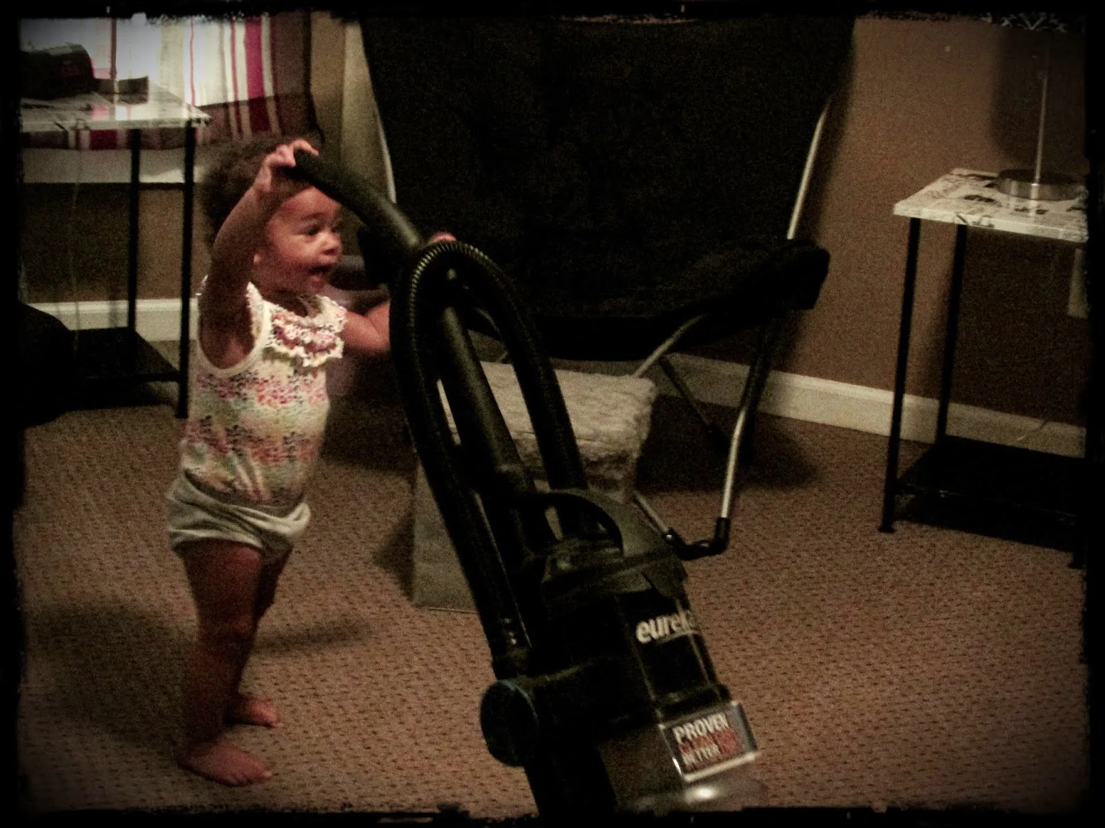 Vacuuming isn't really Miss Fits daily routine. But...it was fun to watch her try. And it's a cute picture!