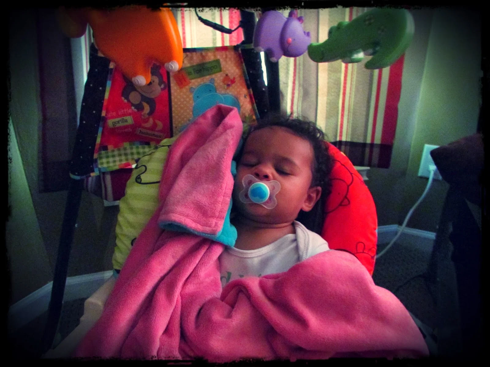 She is clearly too big for this swing that she MUST be in. But since the baby was in it....&nbsp;Also, she's not sleeping. She's pretending.