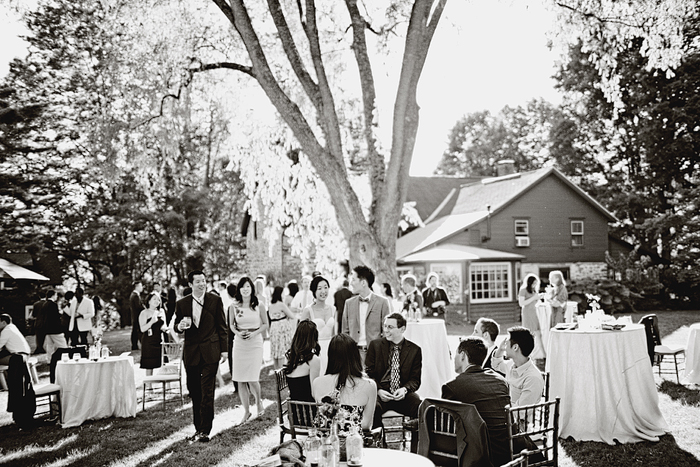 rustic barn wedding cocktail hour under trees