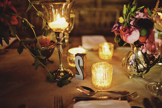 candlelit table with letterpress block table numbers