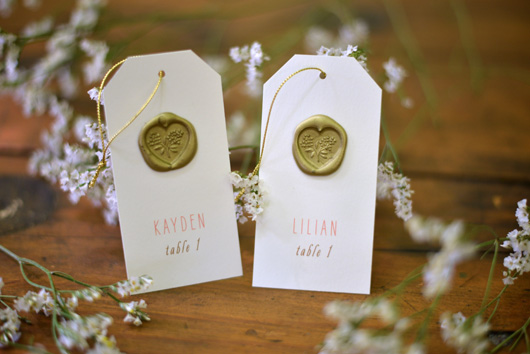 escort card detail with wax seals