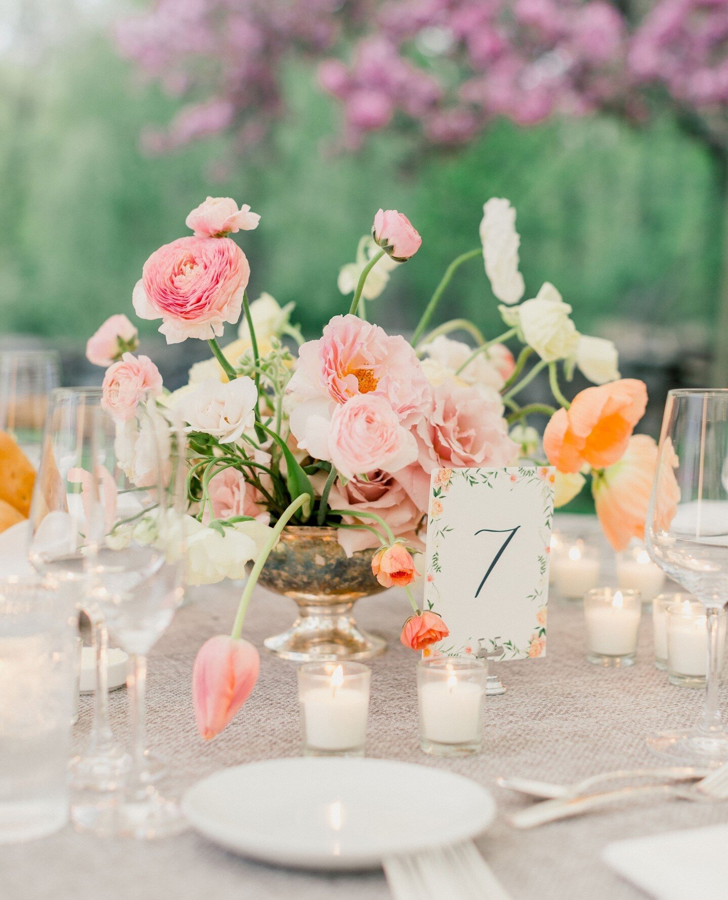 We love taking the beloved details from your wedding invitation suite and tying them into the wedding reception. This couple loved the watercolor floral details we created for their invitation, so we used that as inspiration for their table numbers! 