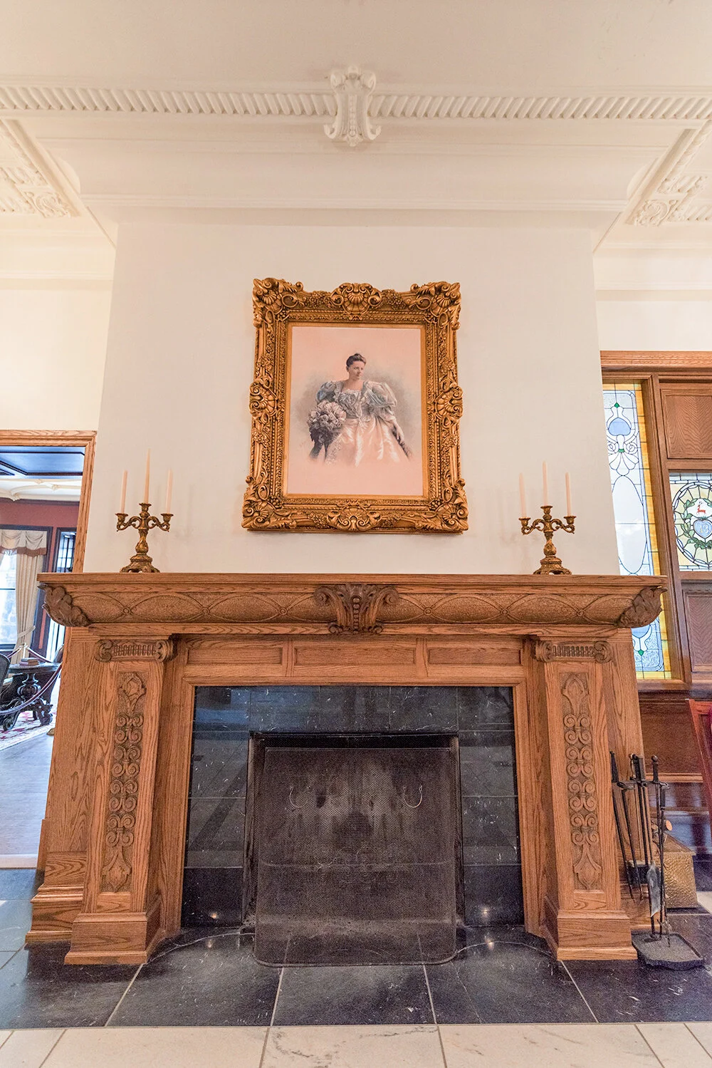 A portrait of Louise Boldt hangs over the fireplace.