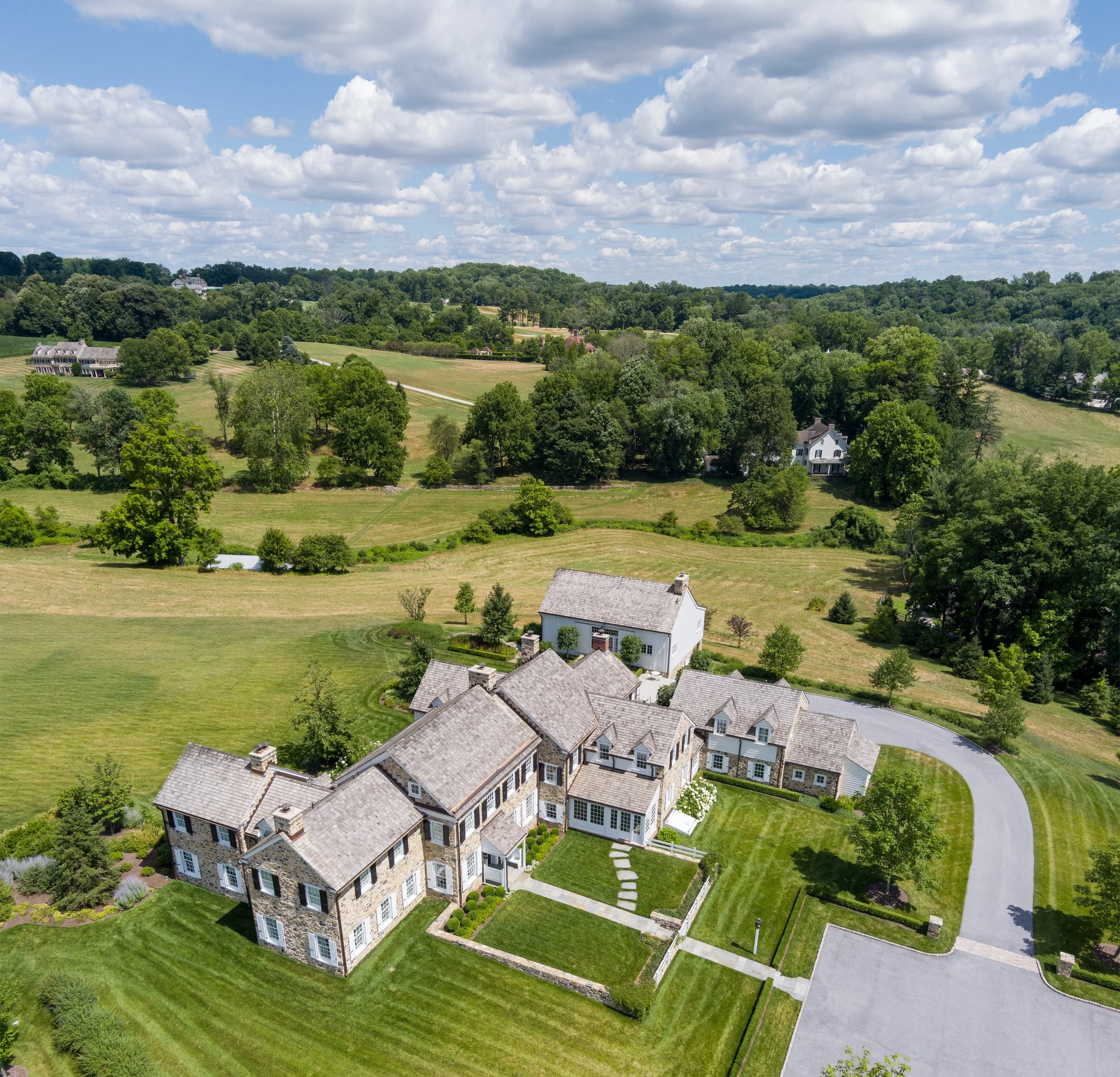   This sprawling house feels even more picturesque in the context of the beautiful rolling hills around it.  