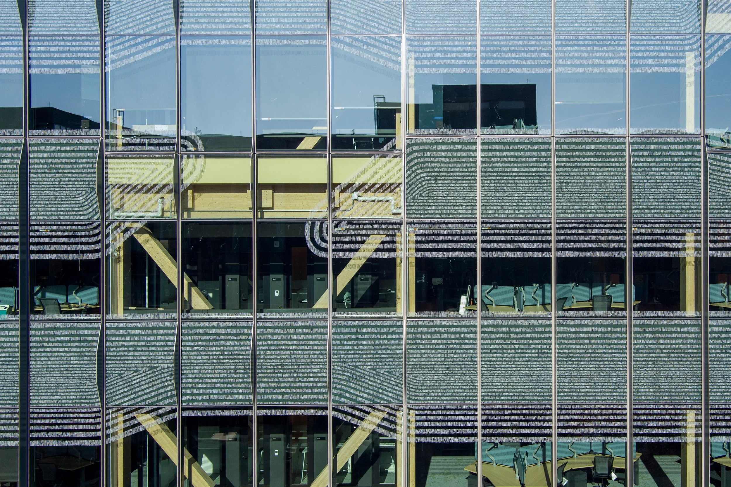   A drone close-up shows the fine-line details on the windows of Gutmann Hall.  