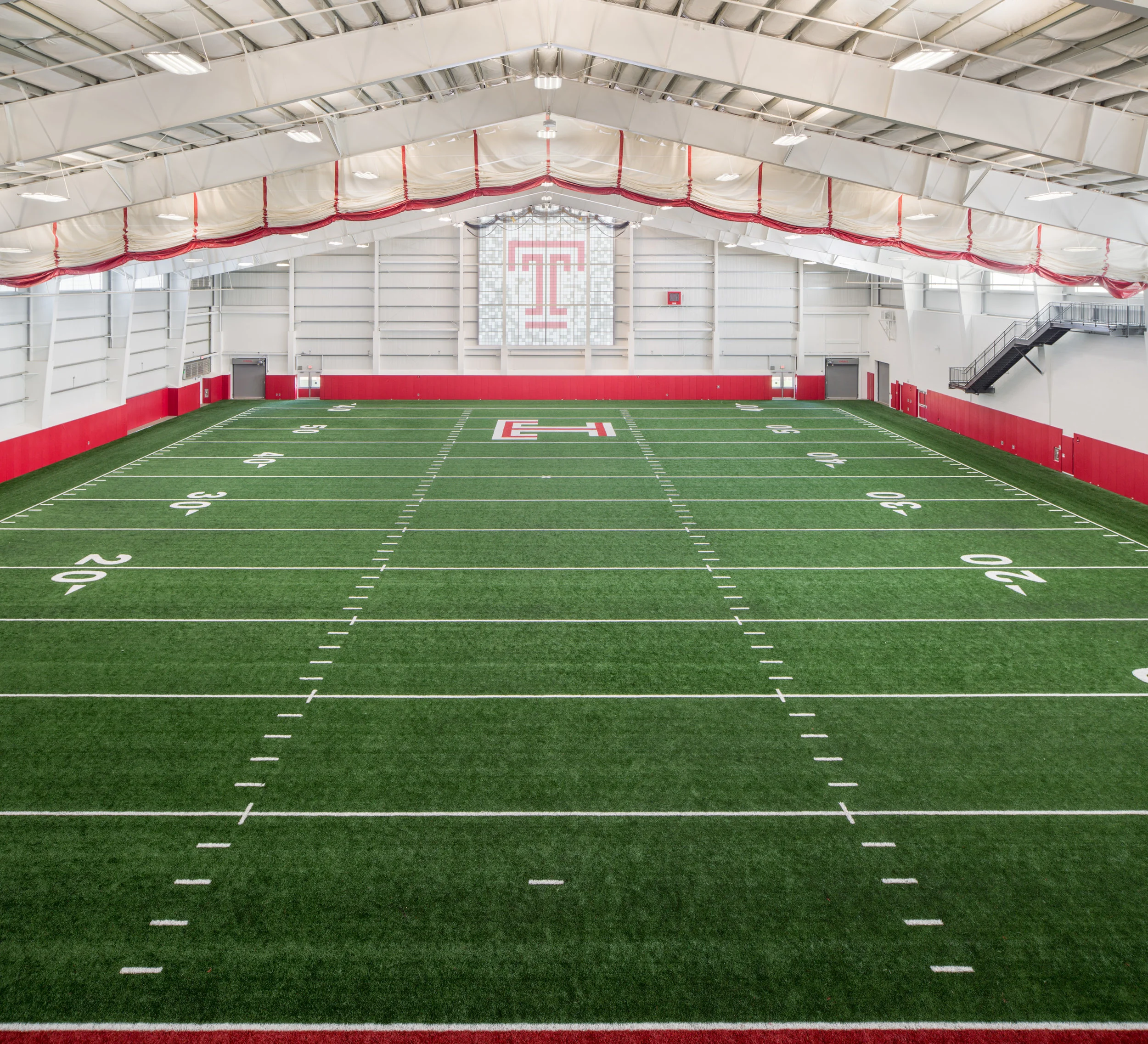 The Indoor Pavilion houses a 70-yard turf field. Capturing the detail in the stained glass logo window was of critical importance to the client.