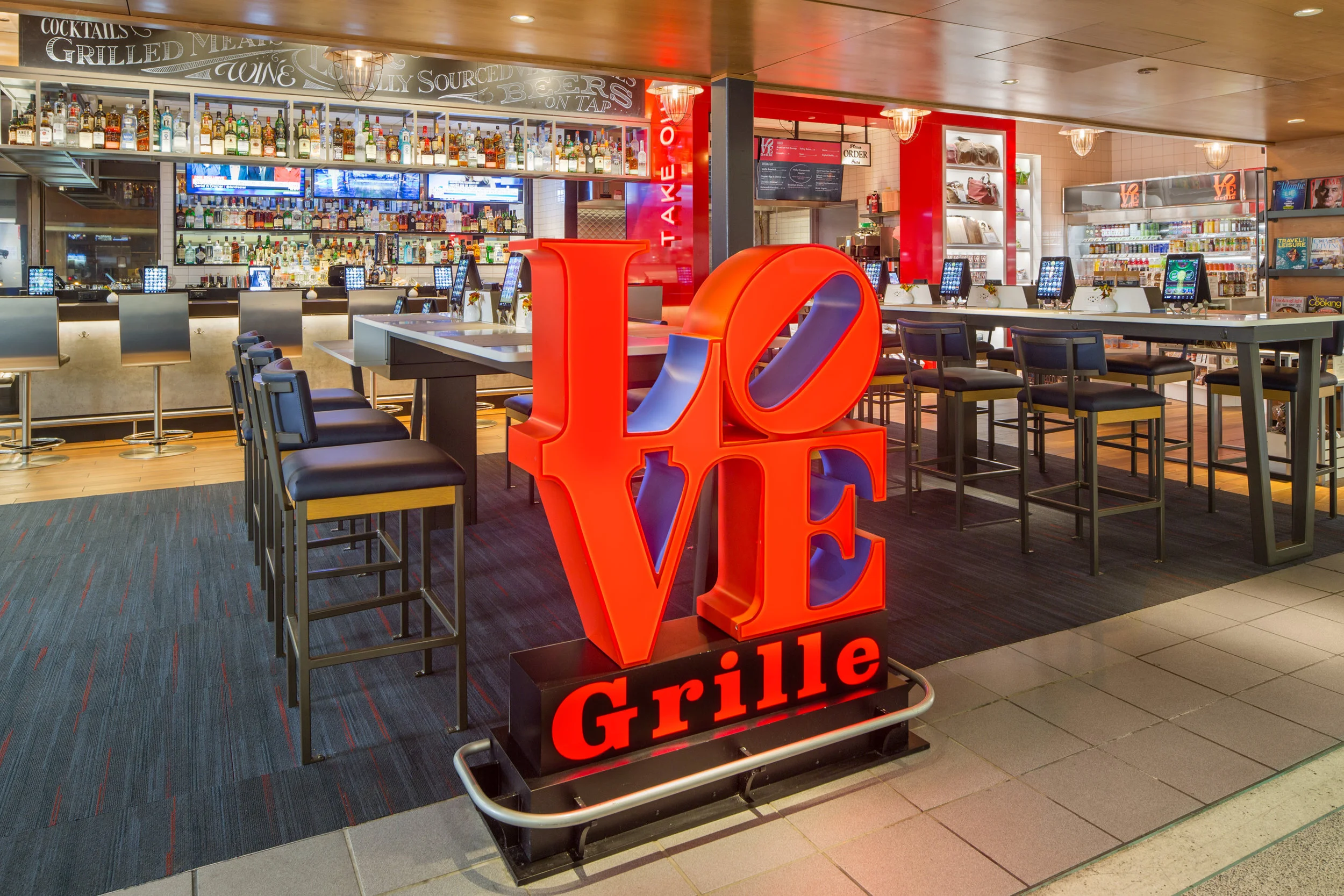 Love Grille with the iconic Love statue logo, features Philly cheesesteaks.