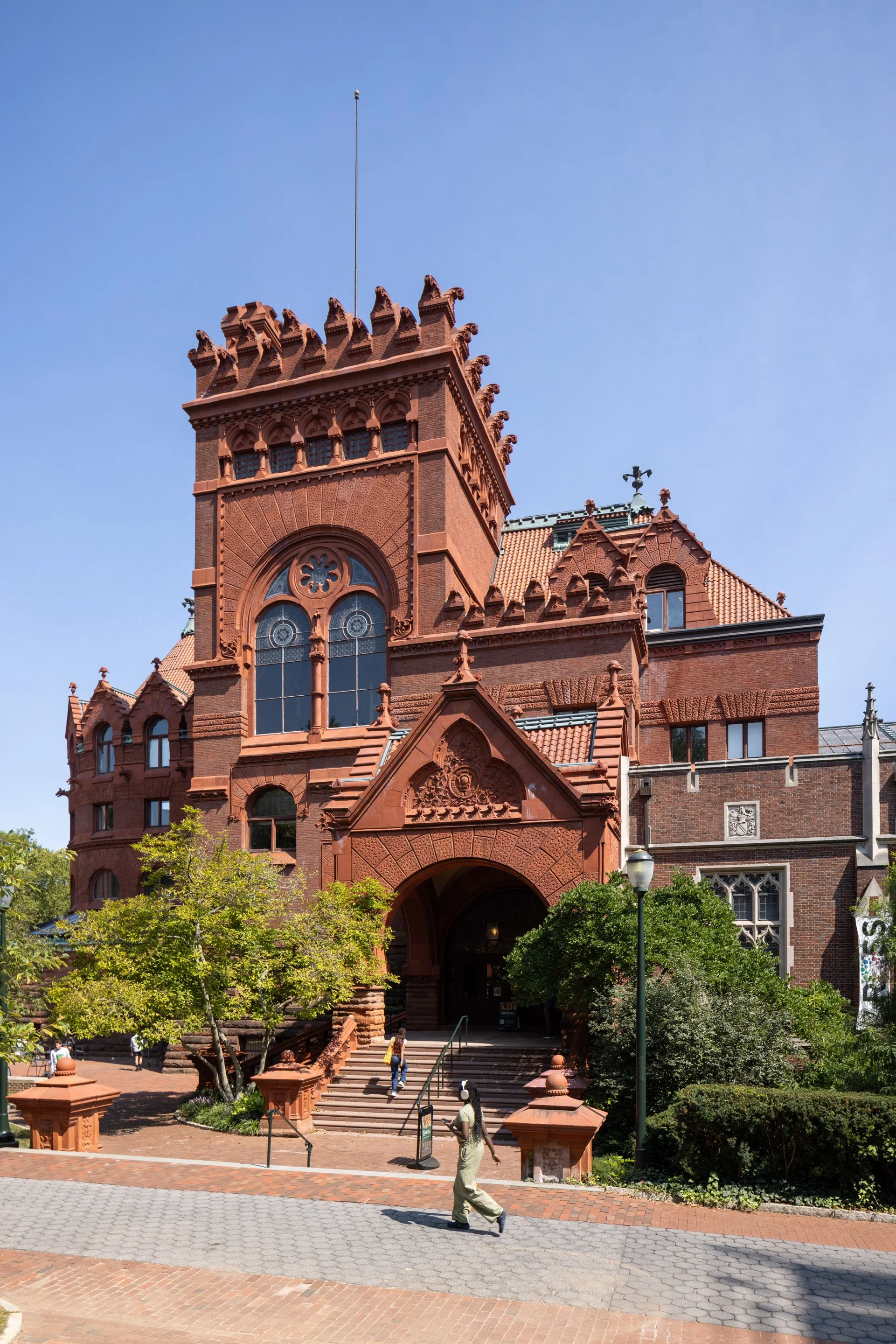   Bright daytime sun highlights the texture and massing of the library’s exterior.  