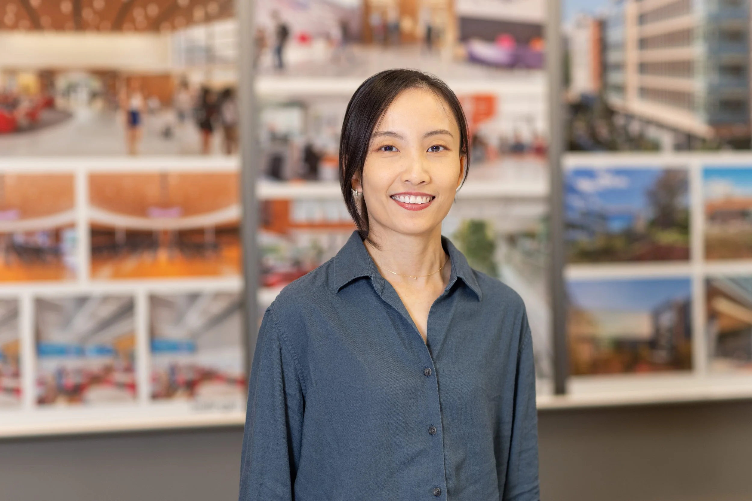   What better background for an architect’s portrait than photos of finished designs…  