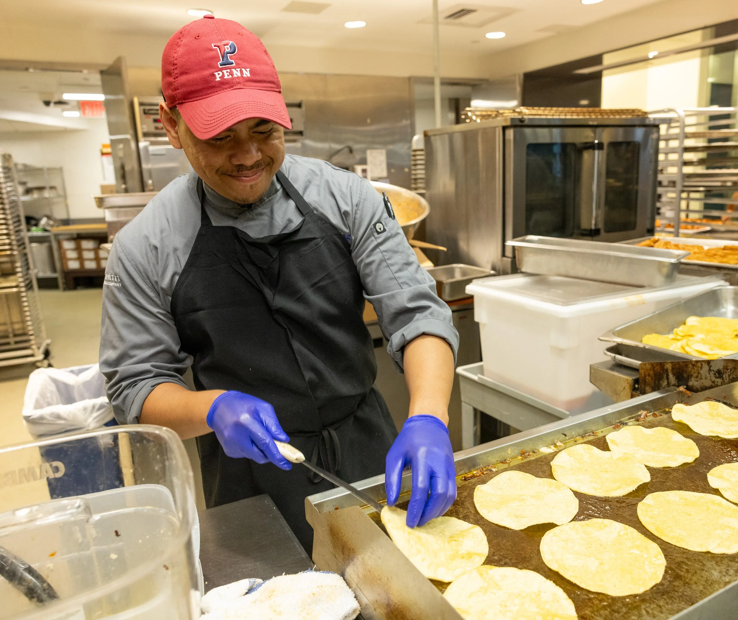   Backstage action: Penn’s culinary team prepared tortillas during Carlos’s talk.  