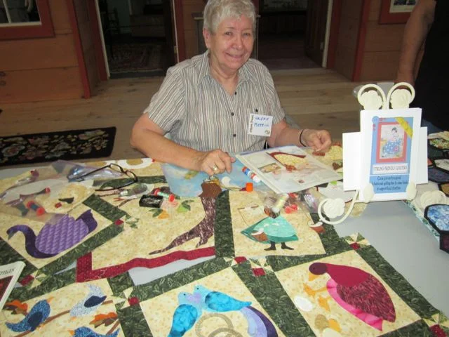 Quilting by hand.