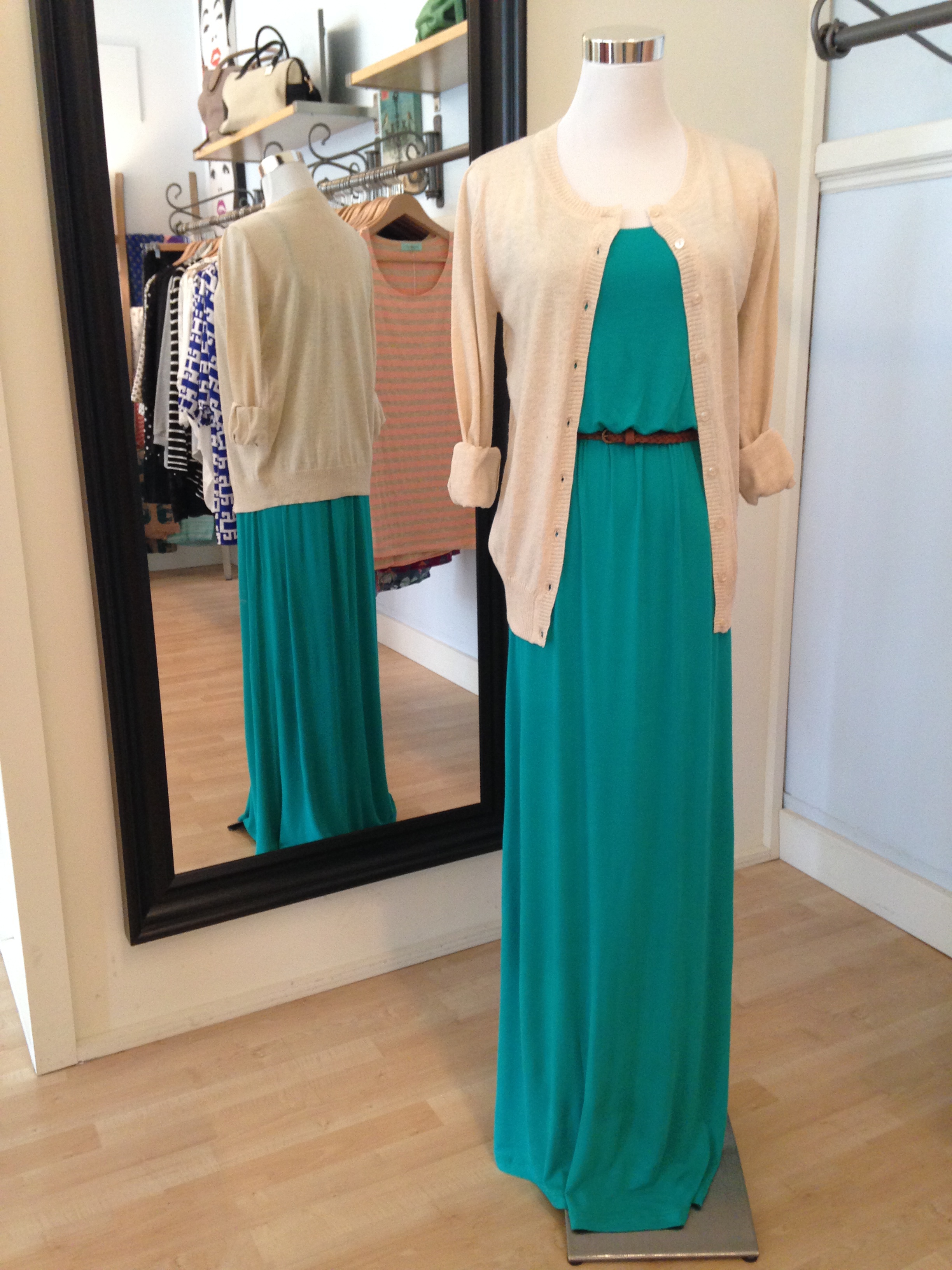 Green maxi dress with belt under an oatmeal cardigan