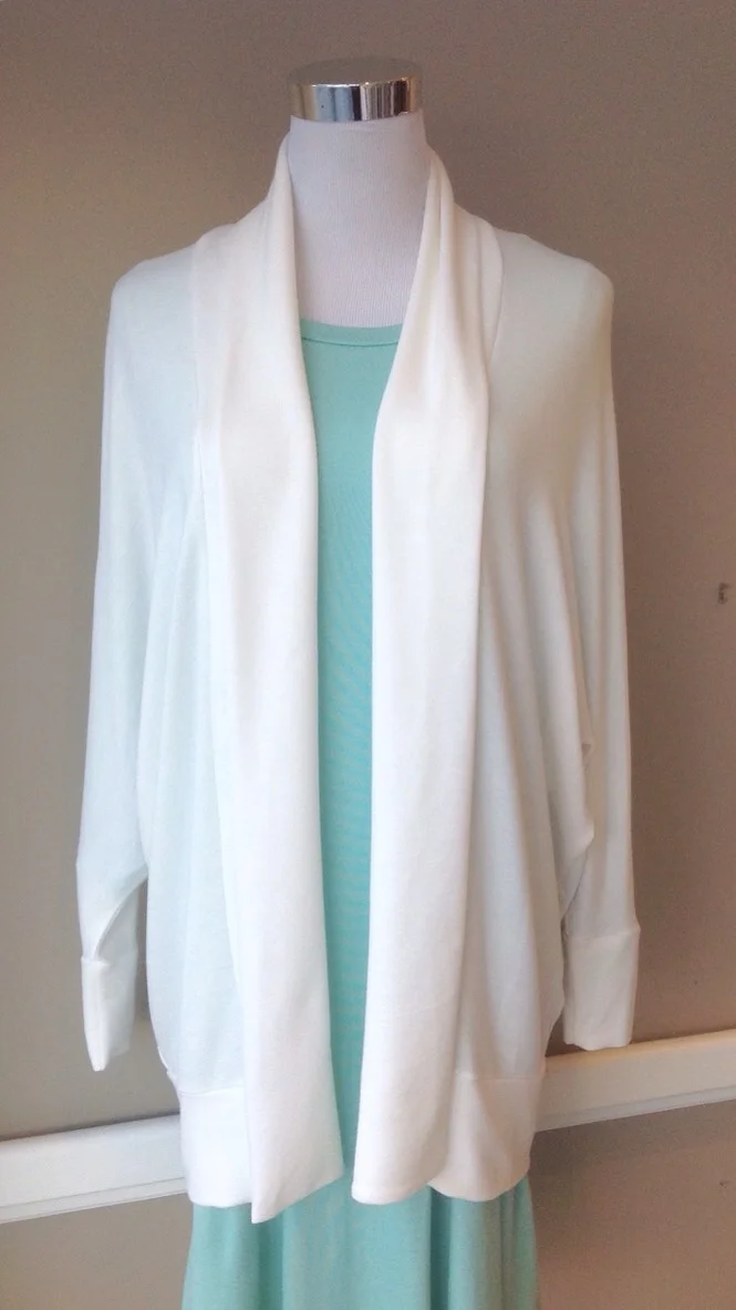 Ivory jersey knit cardigan with shawl collar and batwing sleeves, $35